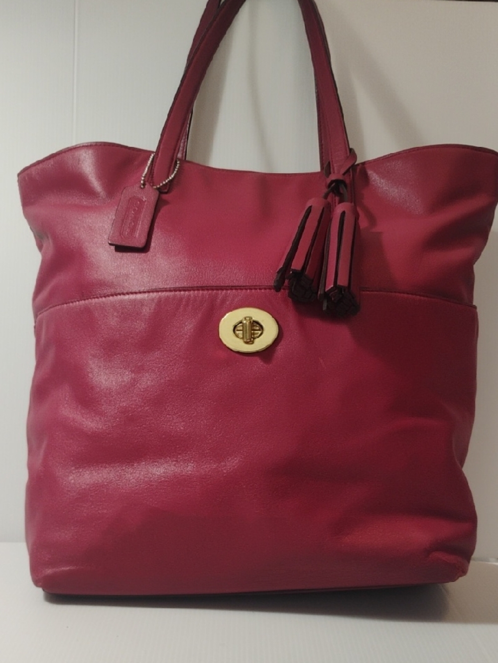 Coach Legacy Leather Turnlock Tote in a vibrant berry 